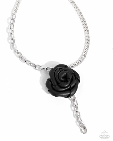 ROSE and Cons - Black
Item #P2BA-BKXX-059XX
A silver cable chain collides with a silver curb chain to create a monochromatic blend of grit. A black leather rosette hangs below the contrasting chains, adding a whimsically edgy touch. The black leather rose