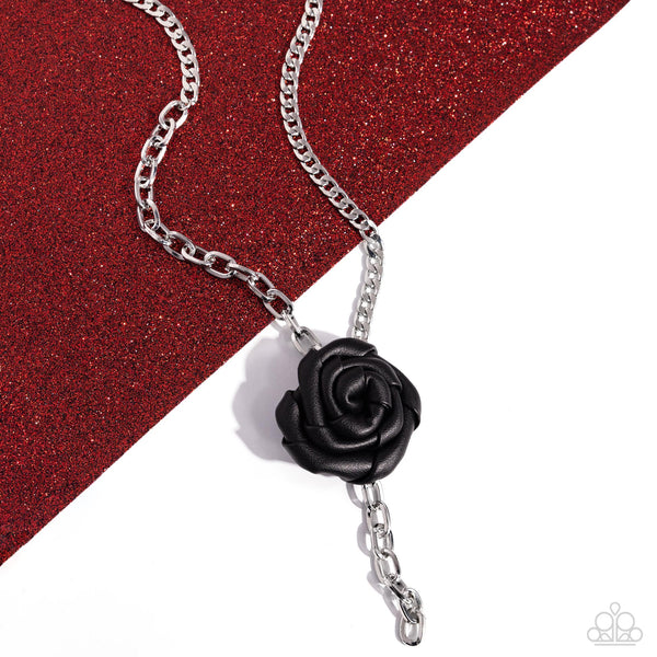 ROSE and Cons - Black
Item #P2BA-BKXX-059XX
A silver cable chain collides with a silver curb chain to create a monochromatic blend of grit. A black leather rosette hangs below the contrasting chains, adding a whimsically edgy touch. The black leather rose